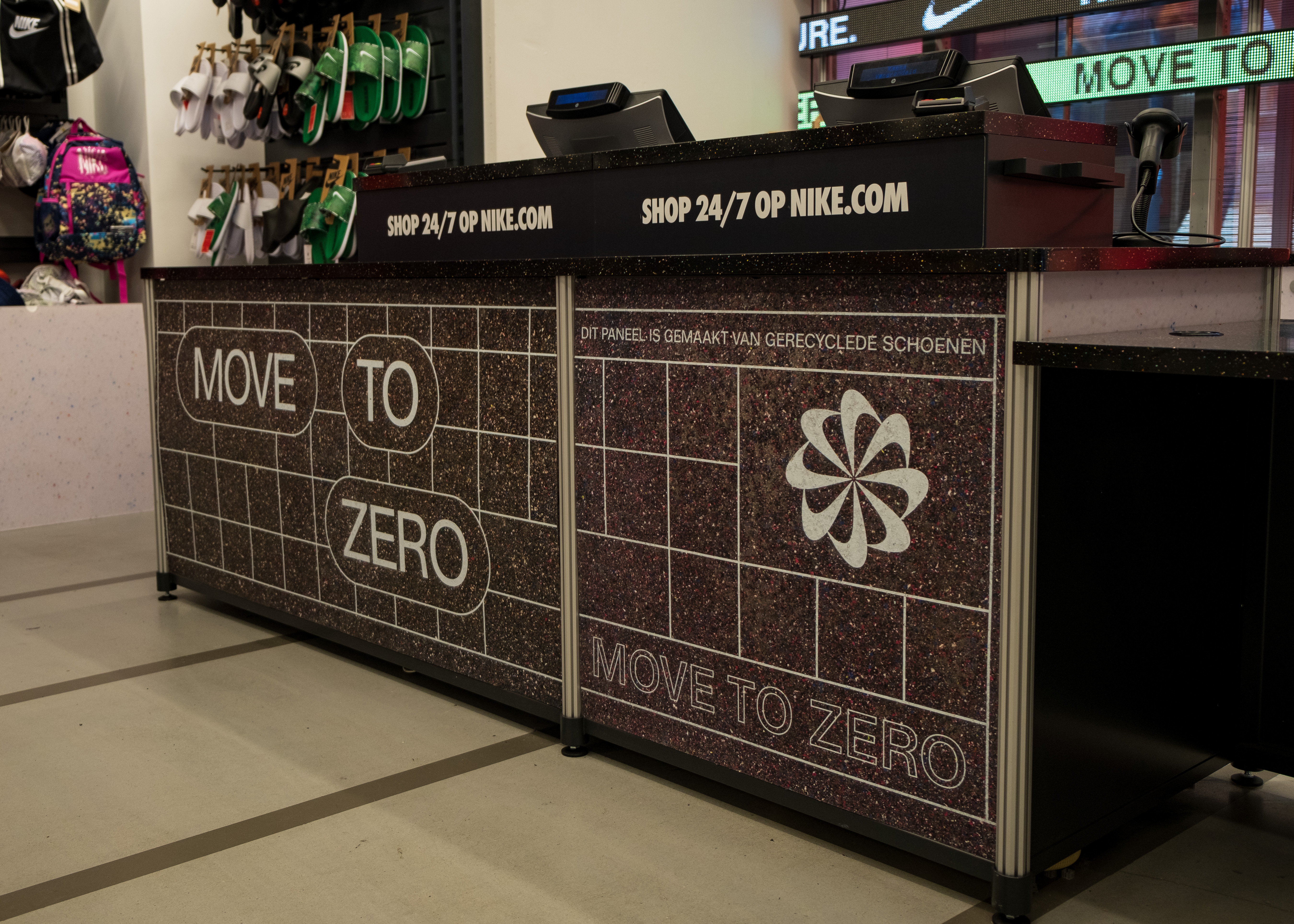 Move to Zero branded checkout desk made from recycled materials