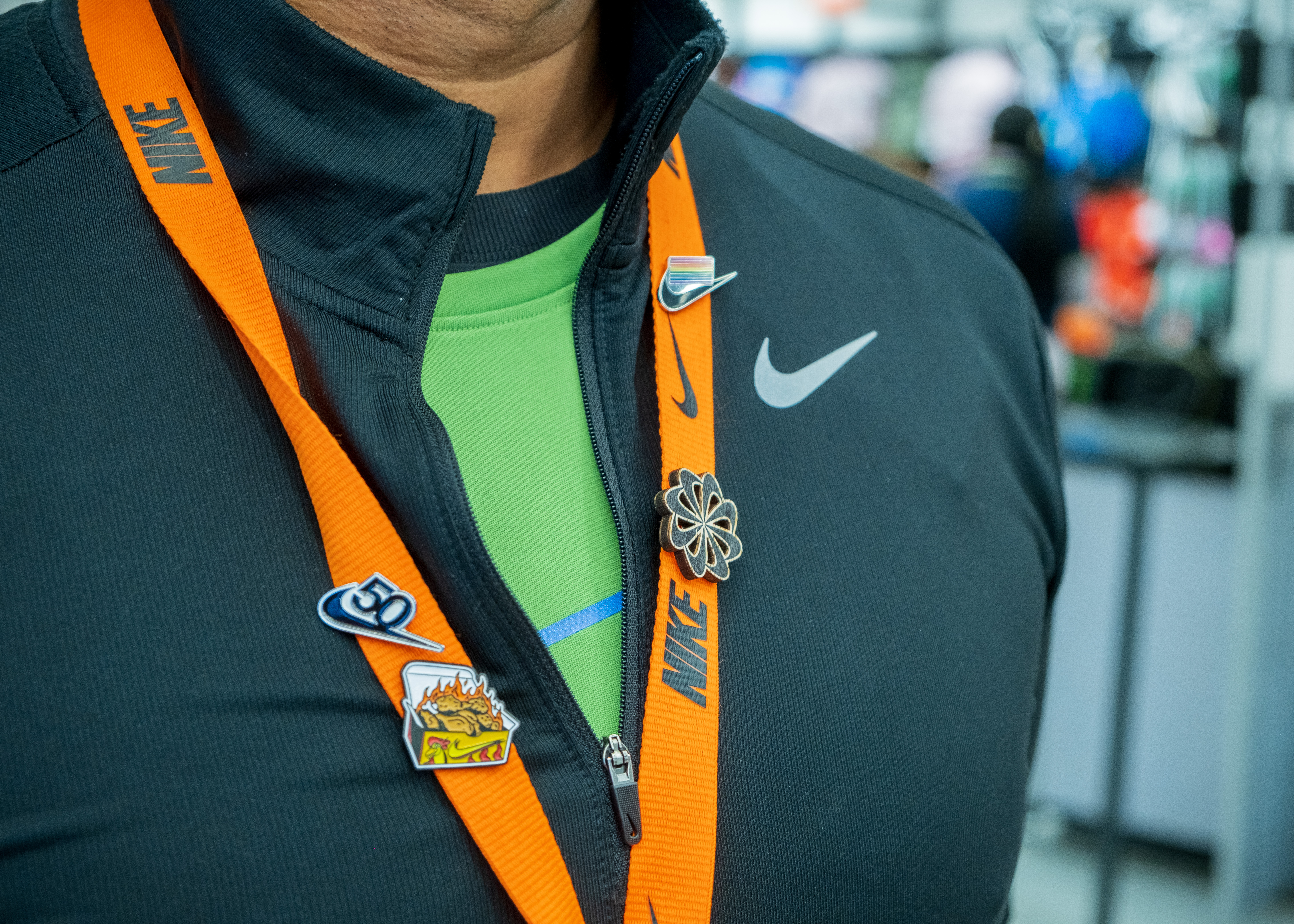 Sustainable Nike staff lanyard and ID badge detail